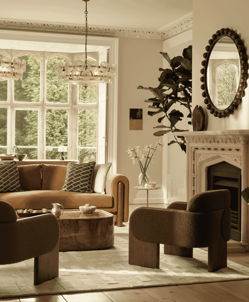 Warmly lit living room featuring a mix of textures, marble, and vintage elements.