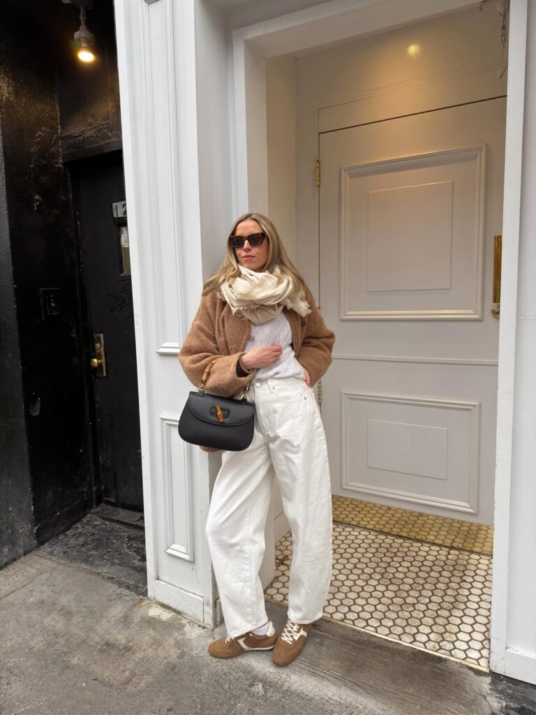 Fashionable woman wearing barrel jeans and classic black Mary Jane flats