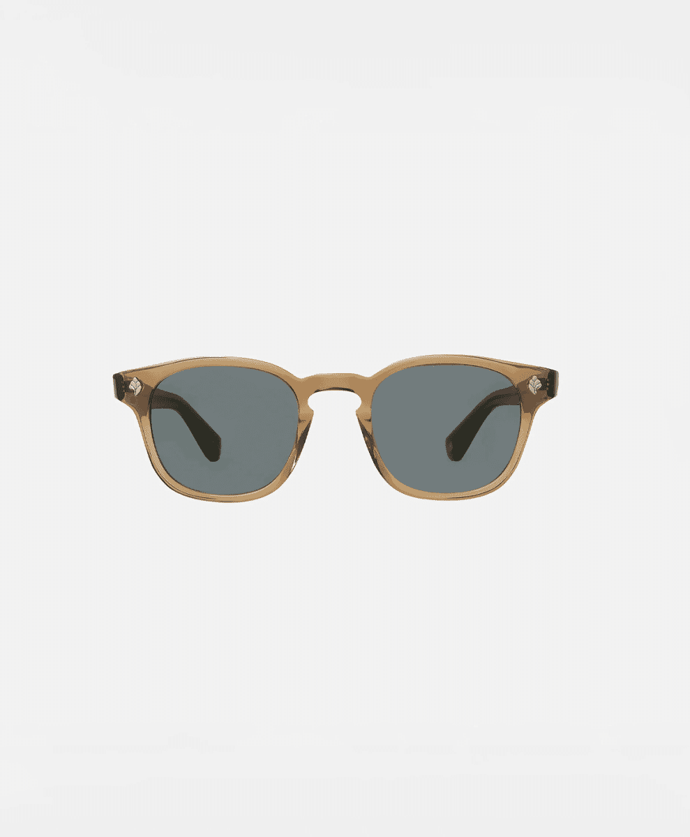 Tortoiseshell sunglasses with gray lenses on a white background.