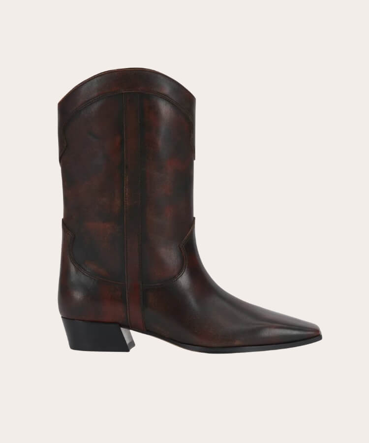 Vince Camuto western booties in a neutral suede finish.