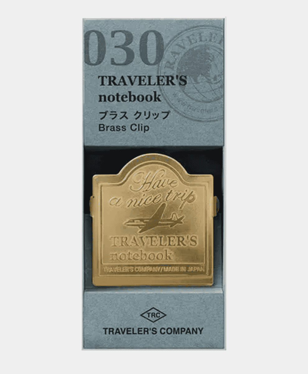 Traveler's Company brass clip with an airplane design.
