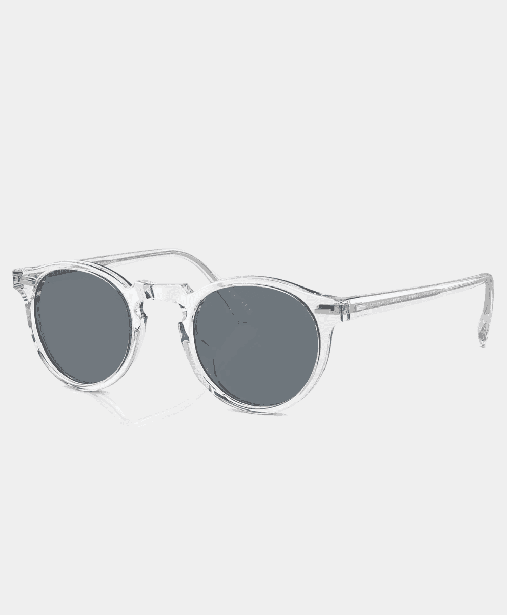 Clear acetate round sunglasses with gray lenses.