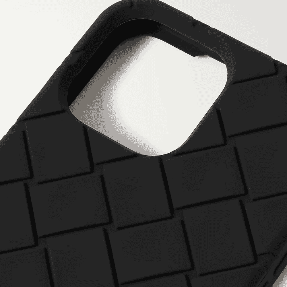 Close-up of a black phone case with a textured woven pattern and camera cutout.