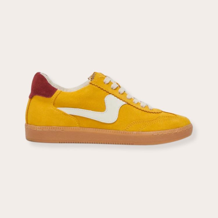 Dolce Vita Notice sneakers in a mustard yellow colorway.