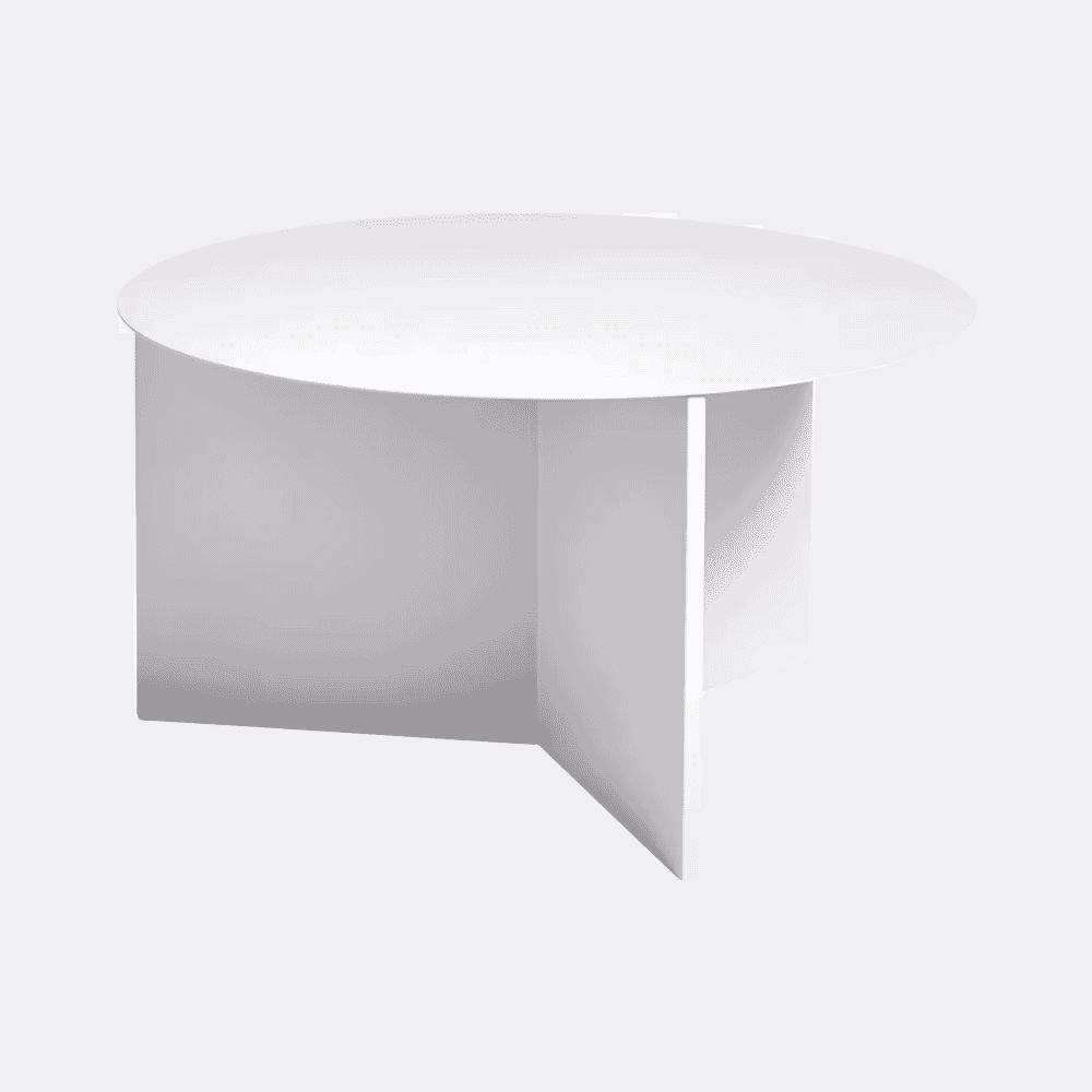 A minimalist white round coffee table with geometric legs against a plain background.