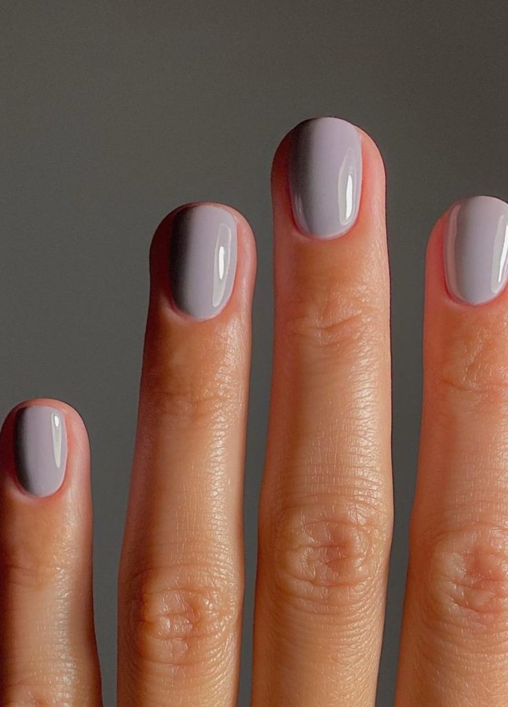 Cool stormy grey nail polish with a high-shine finish.