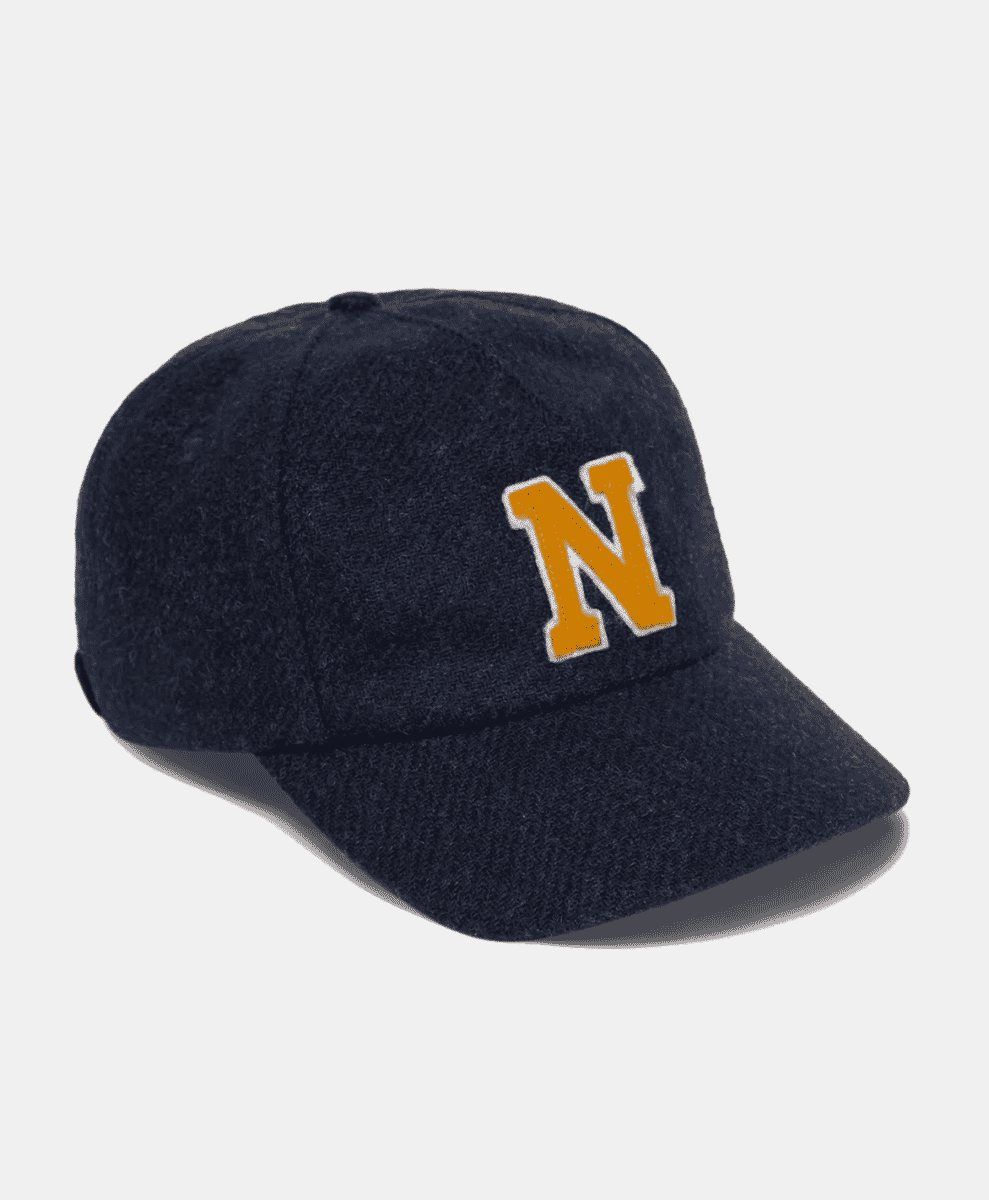 Navy blue wool baseball cap with an orange 'N' logo.