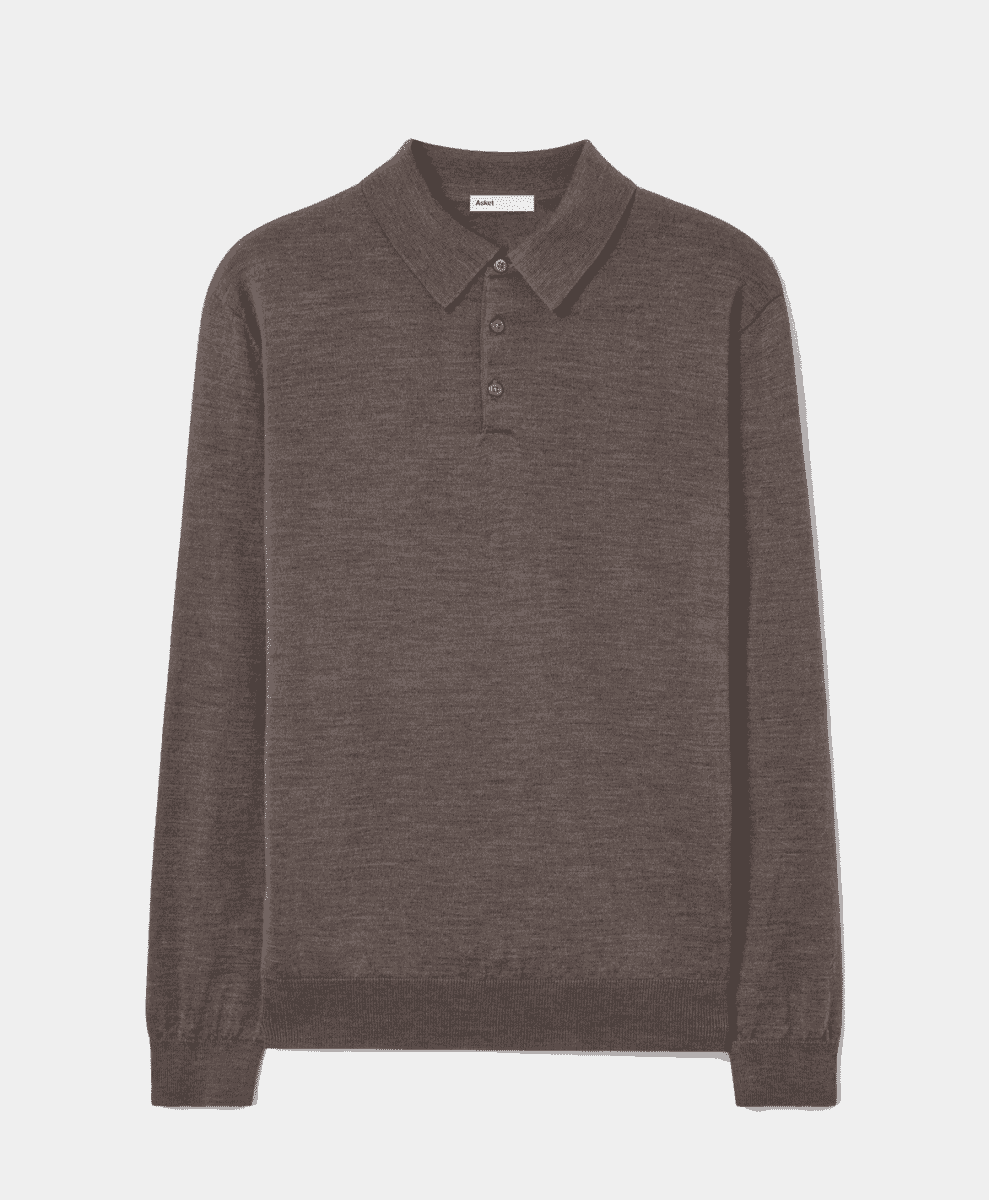 A flat-lay shot of a dark brown merino wool polo sweater with a classic three-button placket.