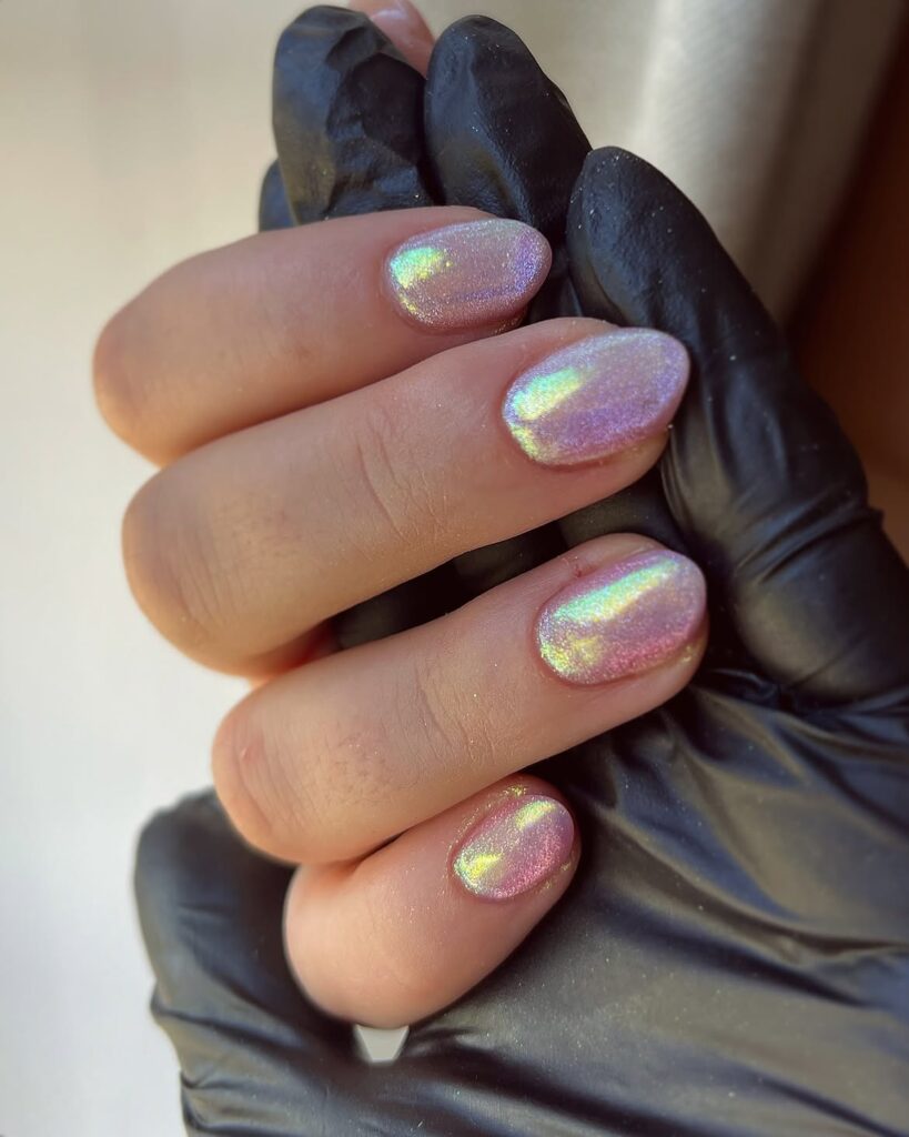 Completed set of mermaid chrome nails with a pearlized finish.