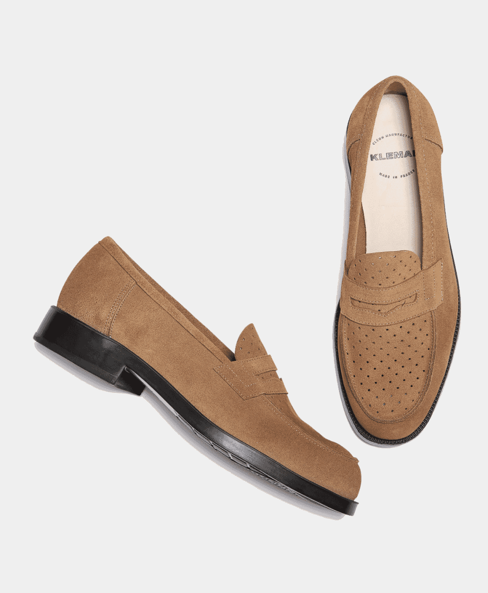 Pair of tan suede perforated loafers displayed against a white background.