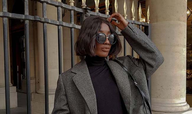 A collection of high-quality fashion essentials arranged as a capsule wardrobe.