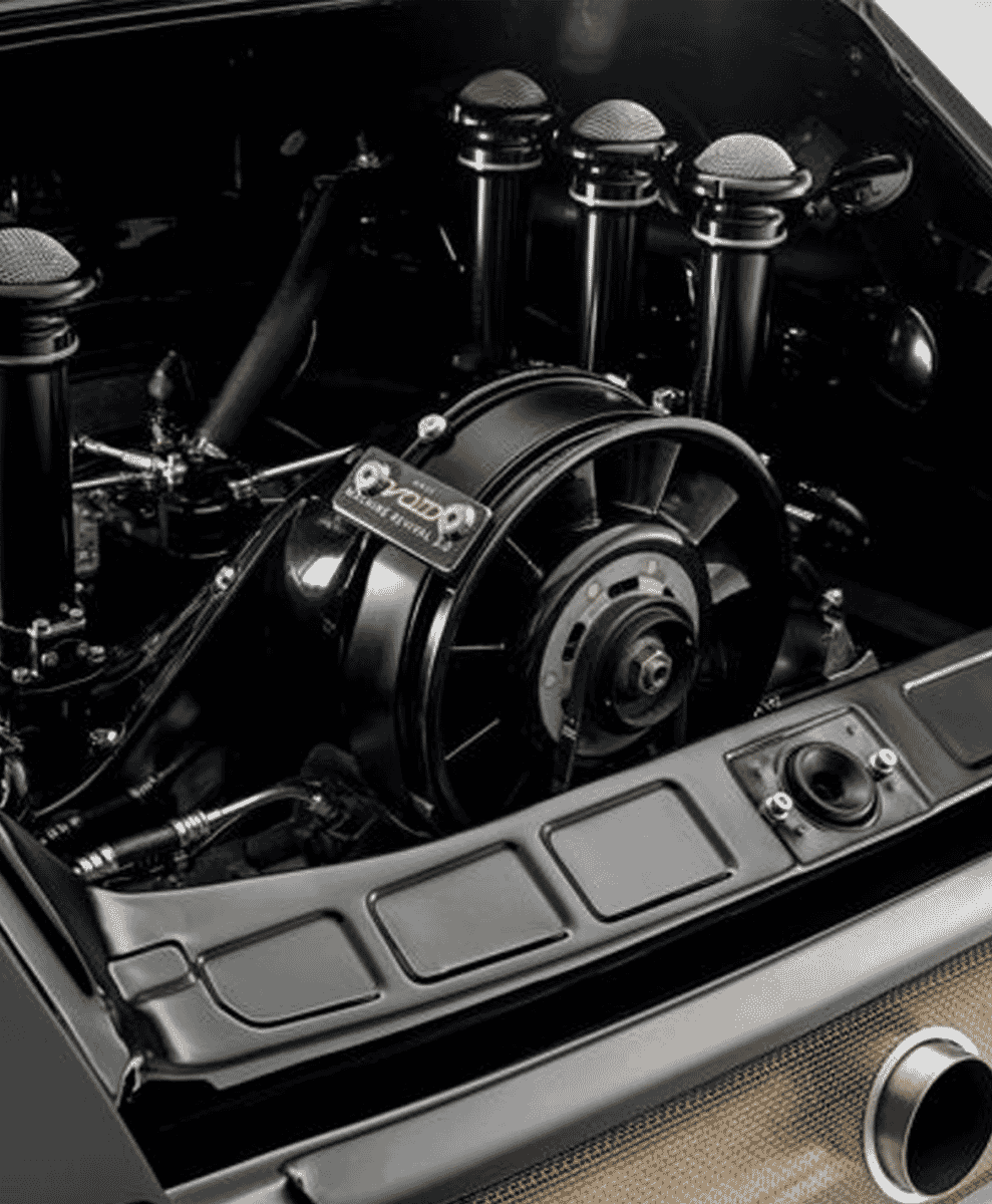 Black and white close-up of a customized car engine with specialized air cleaners.