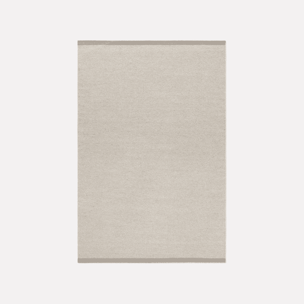 Minimalist rectangular rug with a light beige textured surface.