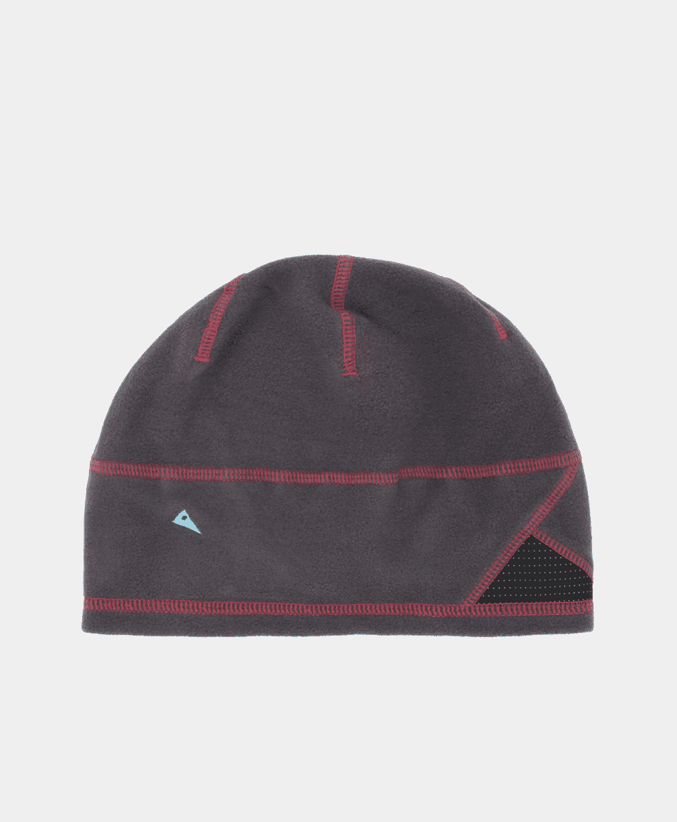 A dark gray fleece beanie with red stitching and a blue logo against a white background.