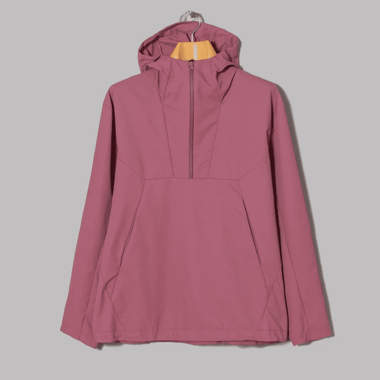 Dusty rose half-zip windbreaker on a hanger.
