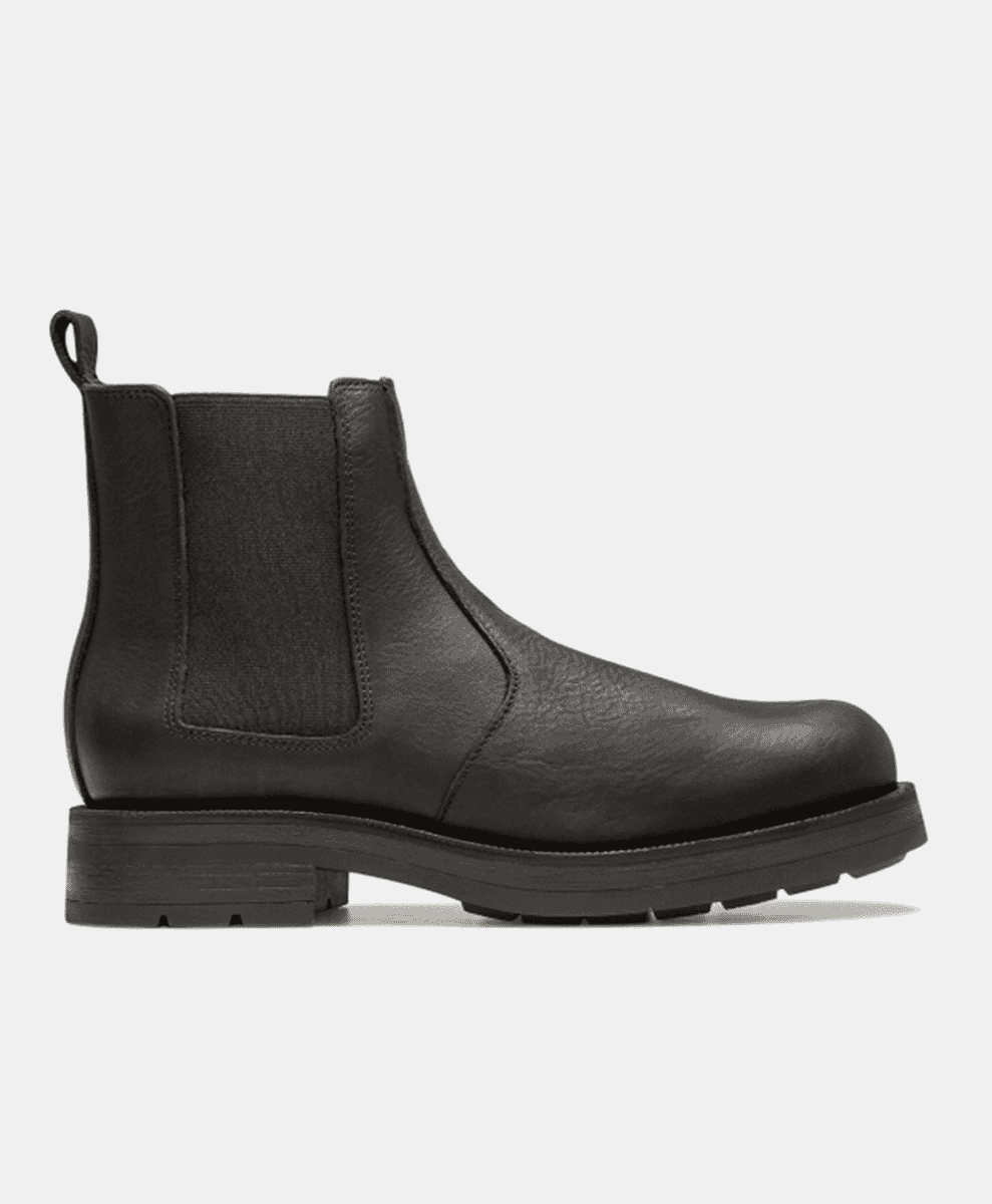 Side profile of a black leather Kleman Chelsea boot with a chunky rubber sole.