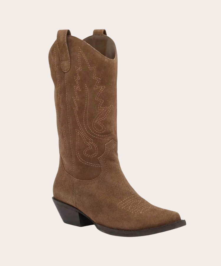 Close-up of Matisse suede cowboy boots showing stitching details.