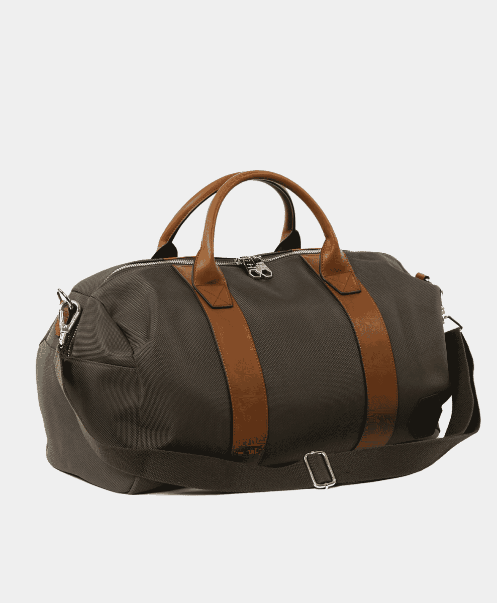 Olive green duffel bag with brown leather accents and metal hardware.