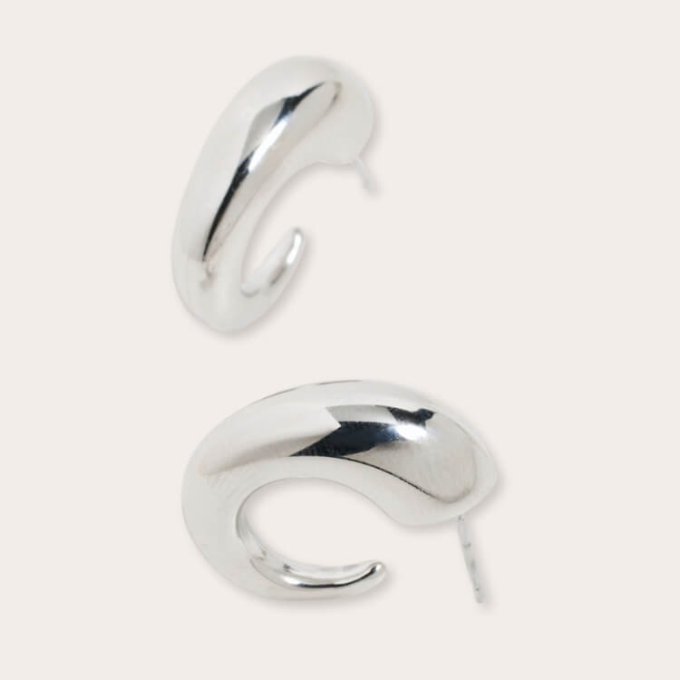 By Adina Eden Bubble Hoop Earrings in silver.