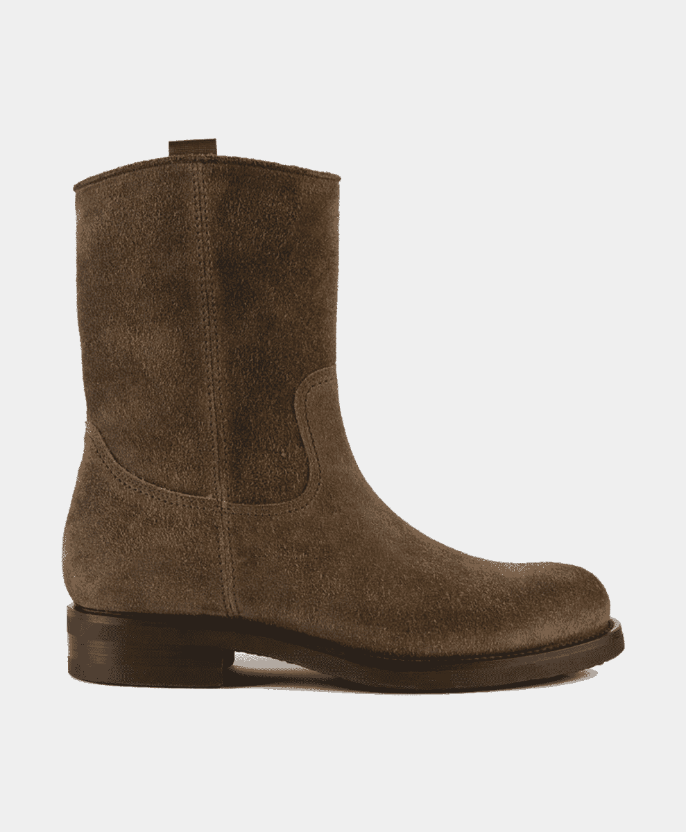 Profile view of a brown suede ankle boot with subtle stitching.