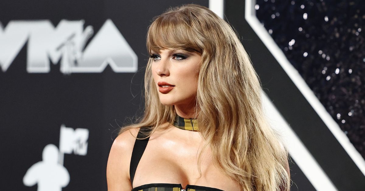 Taylor Swift's fall beauty look with earthy cinnamon lipstick.