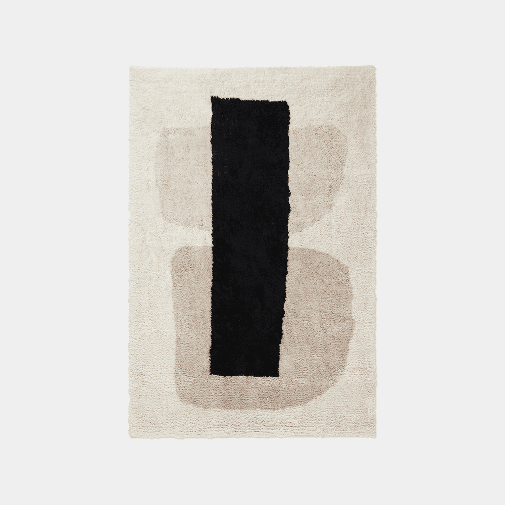 Abstract shag rug with a black vertical stripe and organic beige shapes on a cream background.