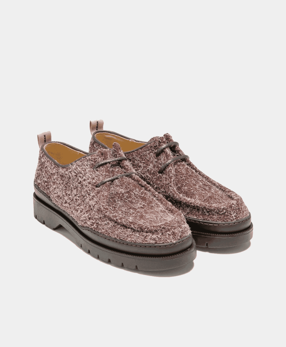 A pair of textured brown suede derby shoes with chunky soles.