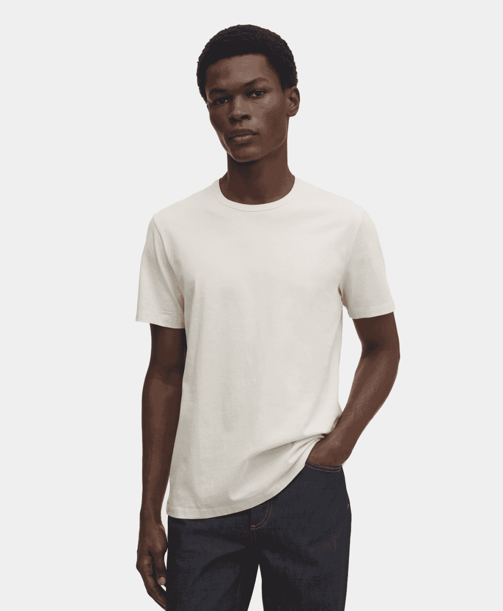 Male model wearing a structured, off-white crew-neck heavyweight t-shirt.