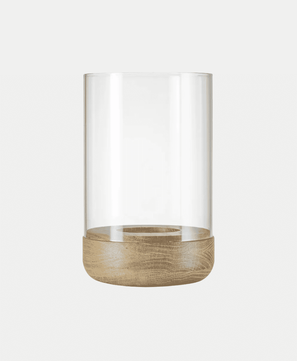 A modern cylindrical glass candle holder with a natural light wood base.
