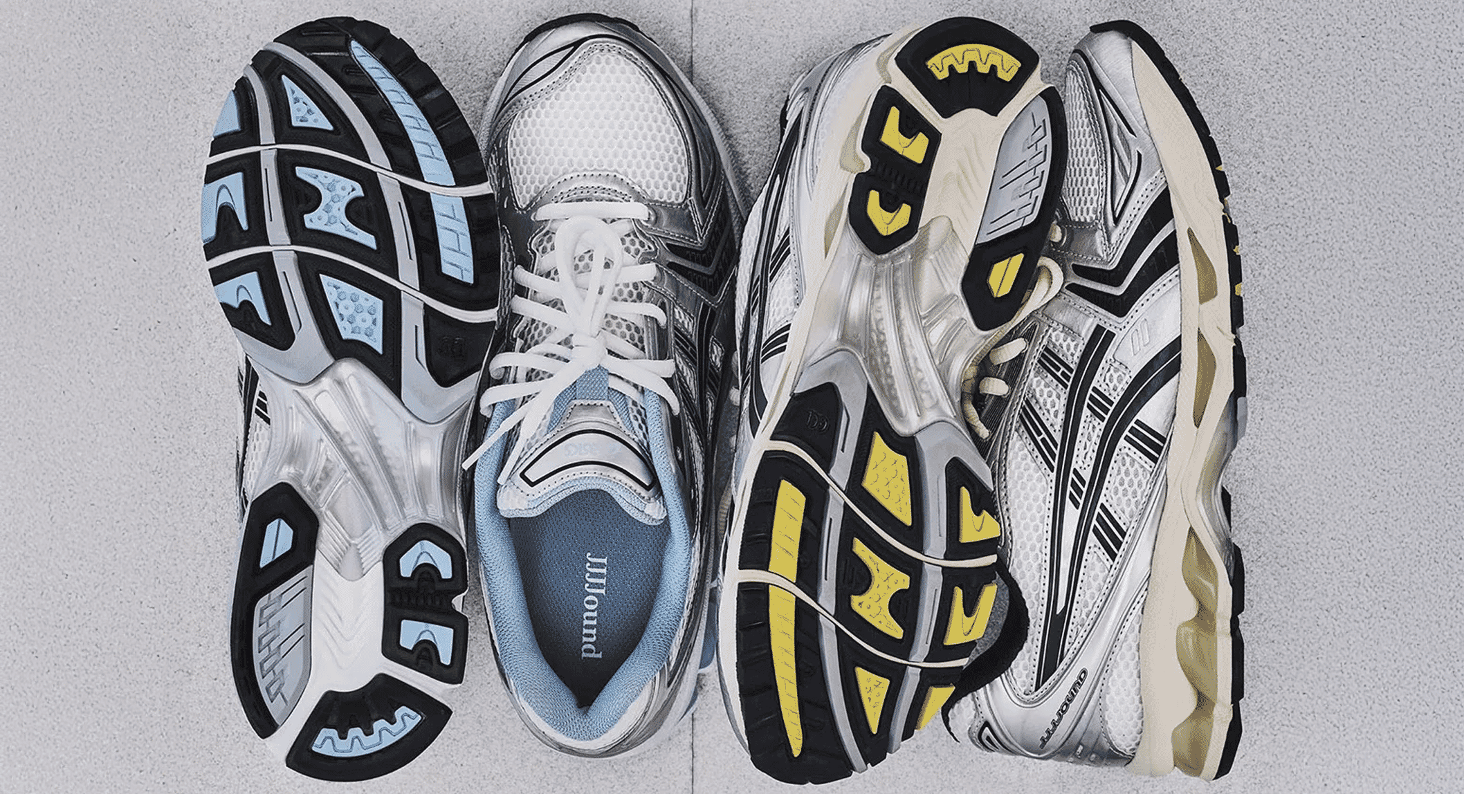 The two primary colorways of the JJJJound x ASICS collaboration presented side-by-side from a top-down perspective.