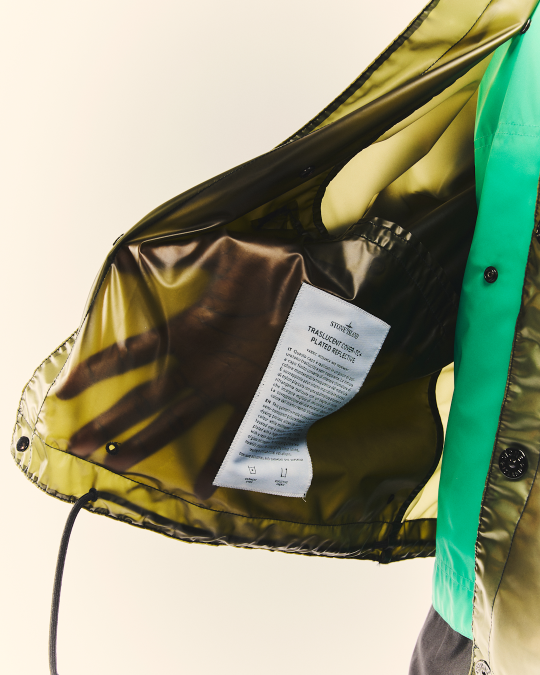 Detailed close-up of the Stone Island translucent cover-TC fabric showing the internal texture.