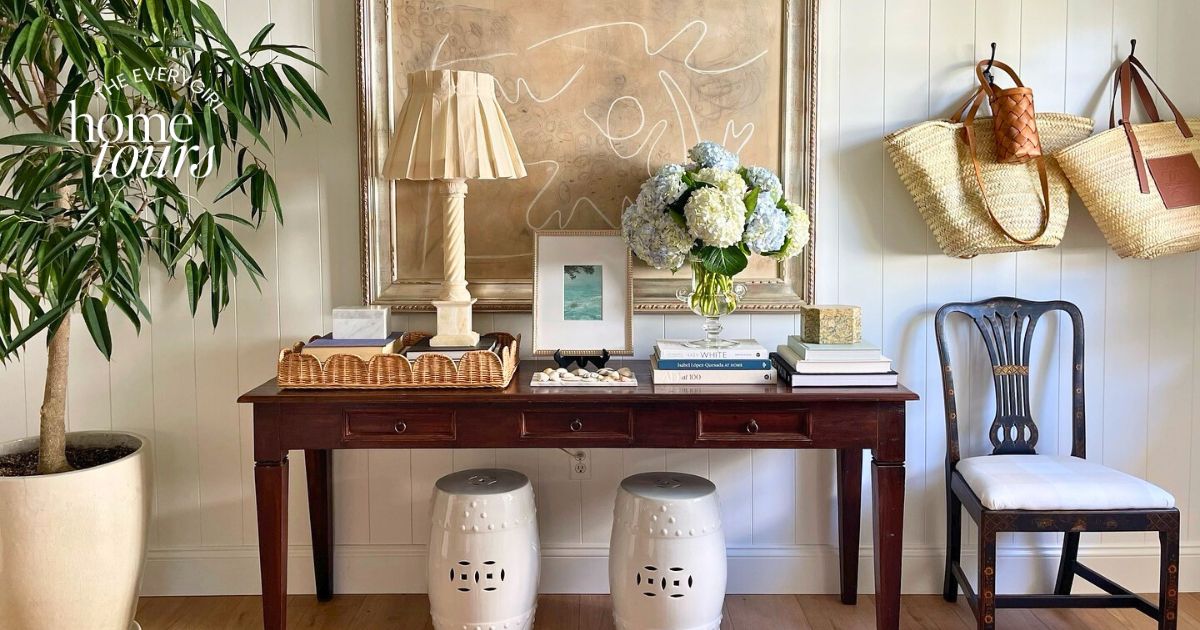 Wide shot of a coastal chic living room with neutral tones and open architecture.