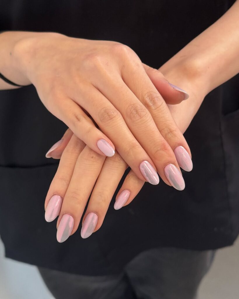 Translucent almond nails with a soft mermaid-core iridescent glow.