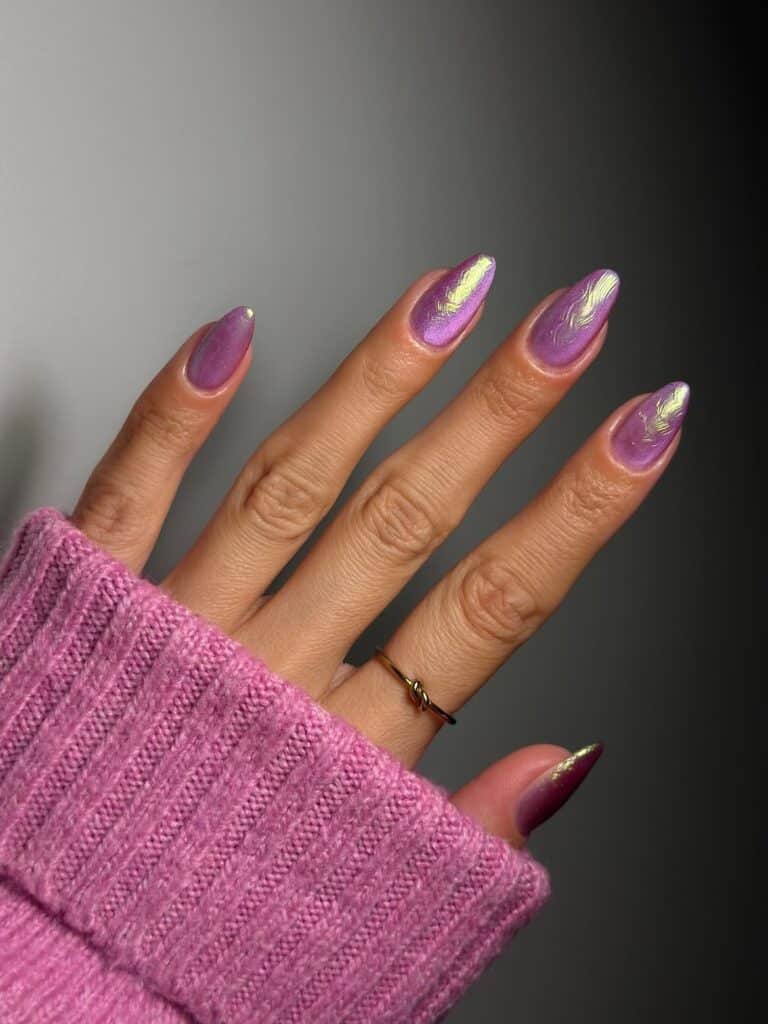 White iridescent nails with raised 3D textures by @swoonmanicures.