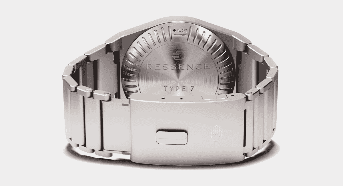 Detailed view of the back of a Ressence Type 7 watch showing the metallic caseback and textured stainless steel bracelet.