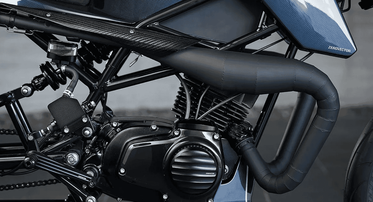 Close-up detail of blue-tinted frame and carbon fiber paneling on a motorcycle.