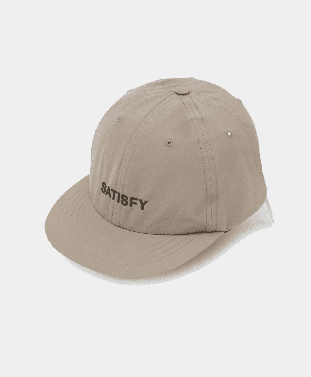 A minimalist beige structured baseball cap with SATISFY embroidery.