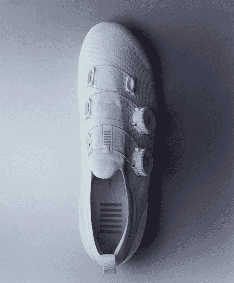 Top-down view of a white Rapha Powerweave cycling shoe with its BOA dial closure system visible.