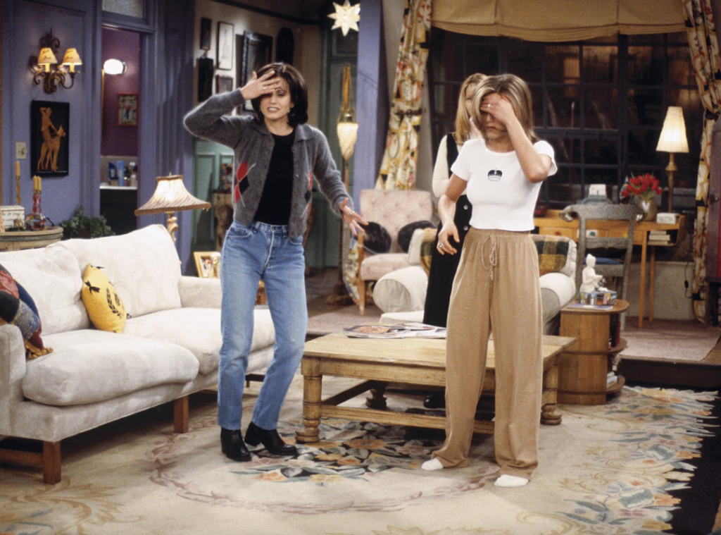 Screengrab of Monica Geller wearing a grey and white argyle cardigan.