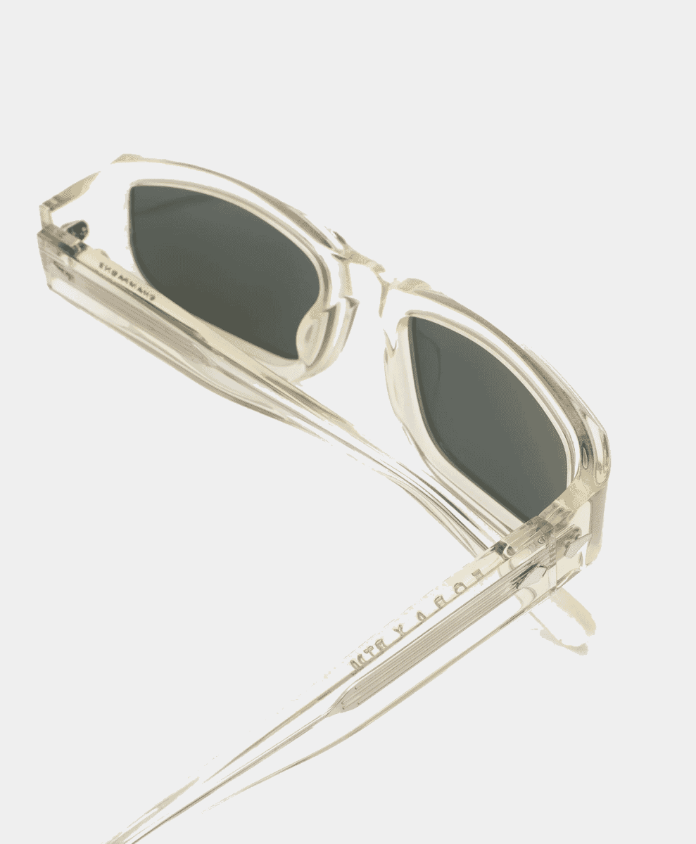 FORA x PTM Sunglasses resting on a wooden surface