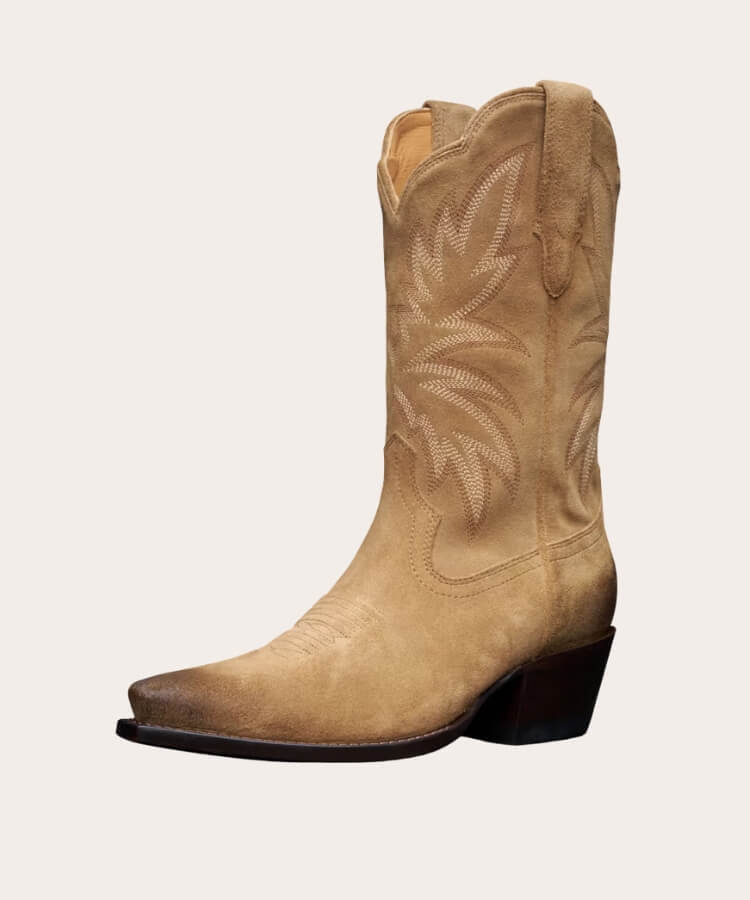 Studio shot of Tecovas suede cowgirl boots in a tan shade.