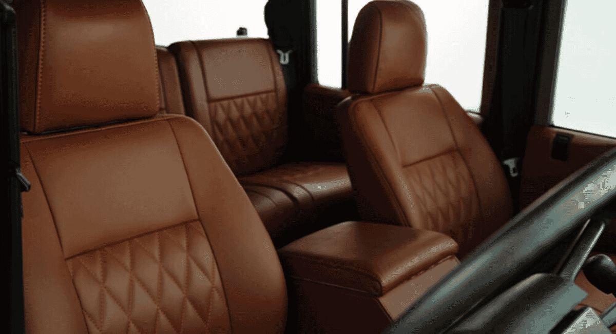 Luxury brown leather car seats with premium diamond-stitched upholstery.