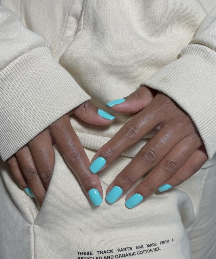 Bright aqua blue nails with a glossy finish.