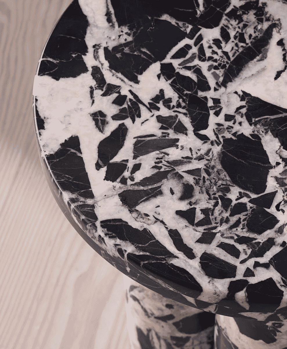 Close-up of a Noir Grande Marble side table with black and white veining.