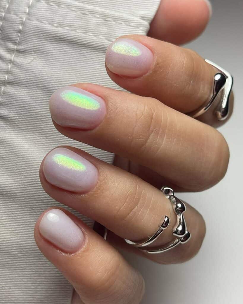 Vibrant lagoon blue chrome nails with a high-shine finish.