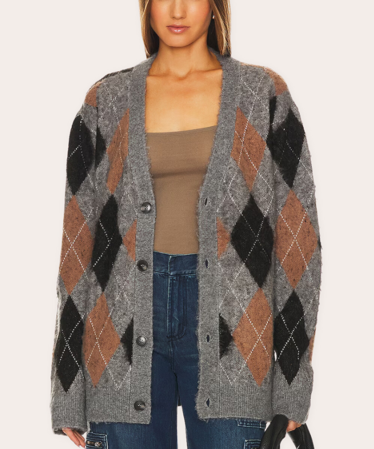 Product shot of a blue and white WAO argyle button-up cardigan.
