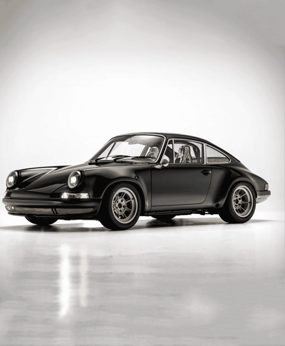 Sleek black Porsche in a minimalist studio with soft lighting.