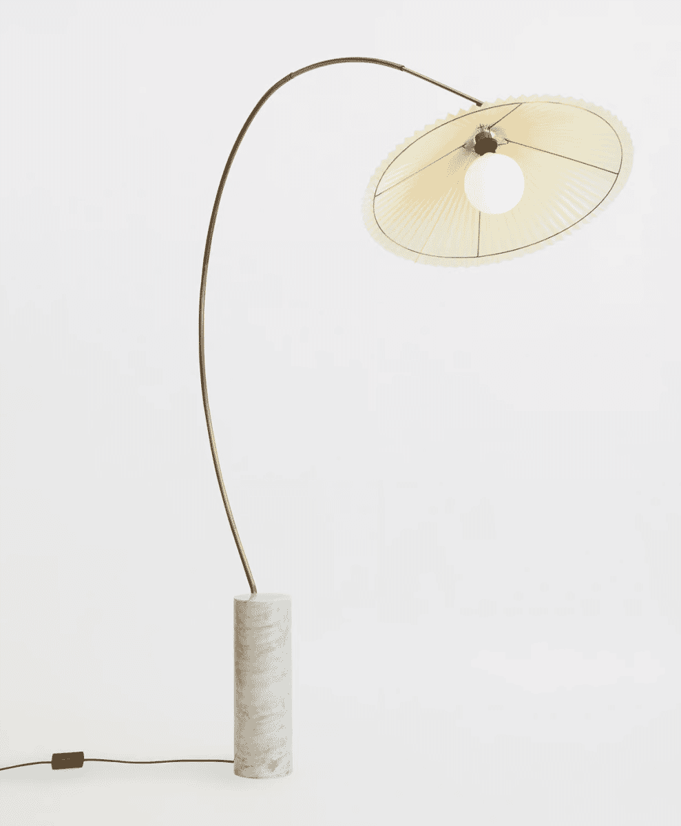 Modern Soho Home Arc floor lamp with a brass arm and marble base.