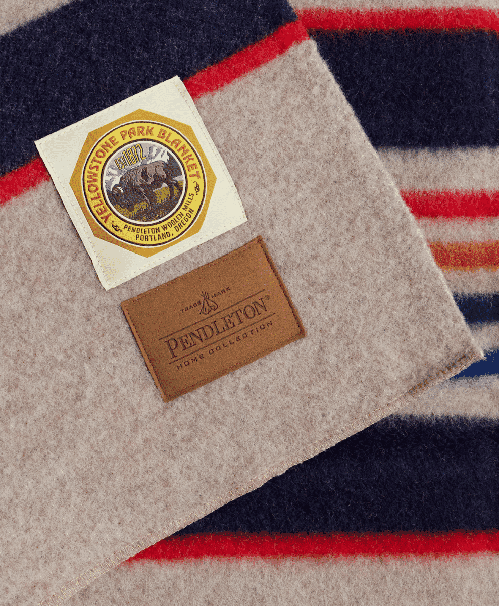 Close-up of a Pendleton heritage label on a striped wool blanket.
