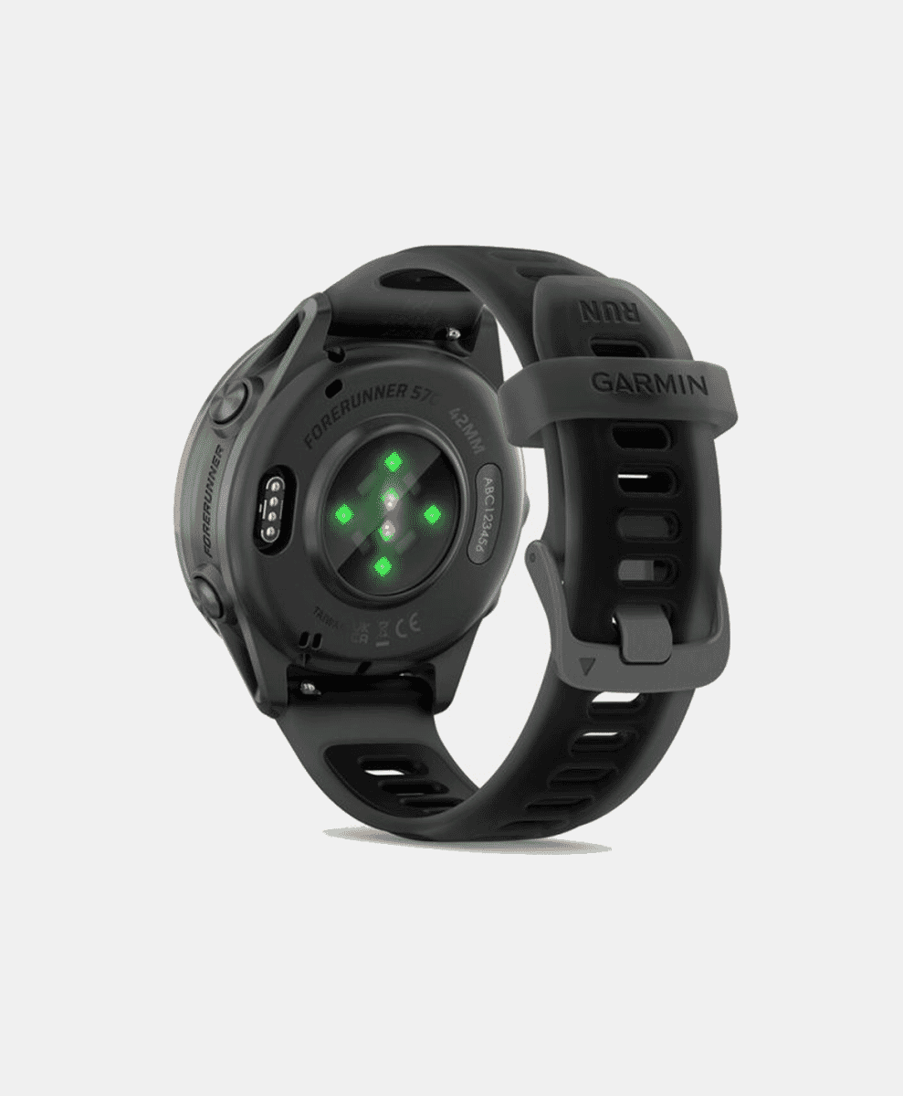The back of a Garmin smartwatch with green heart rate sensors illuminated.
